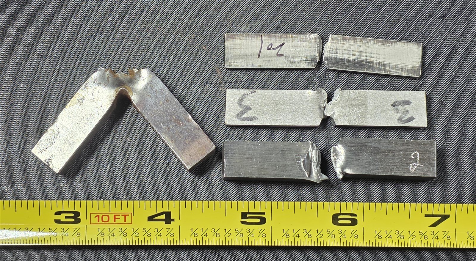 Broken Charpy V-notch impact specimens