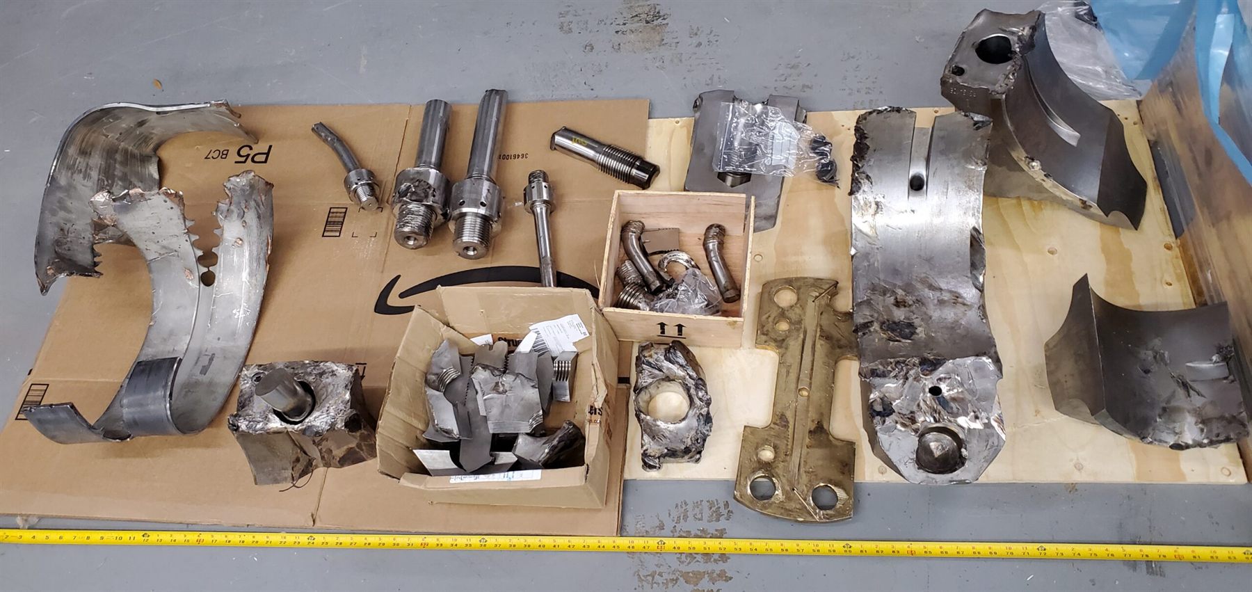 Large diesel engine components undergoing failure analysis