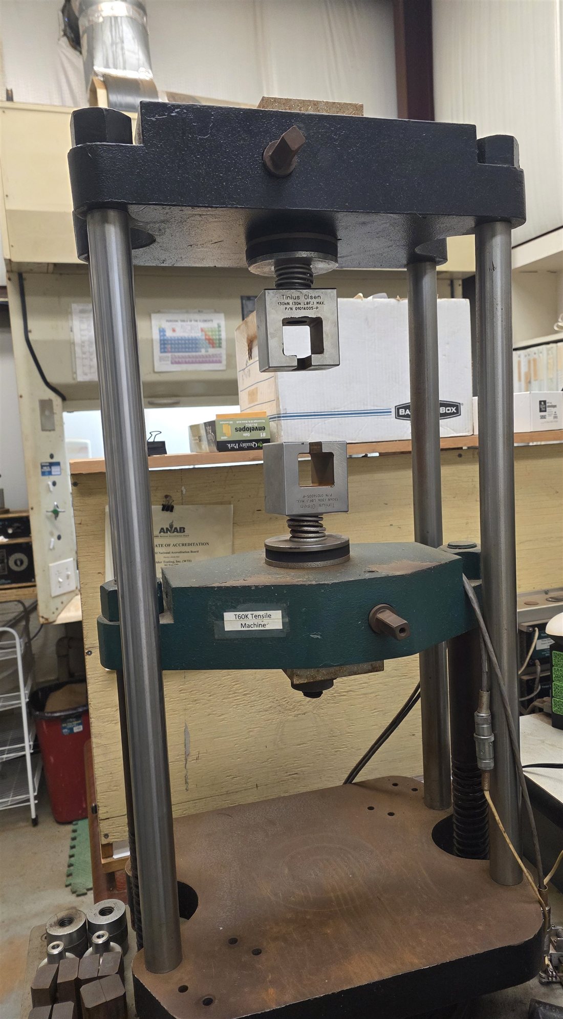 Tensile testing frame rated to 60,000 lbf with wedge grips installed